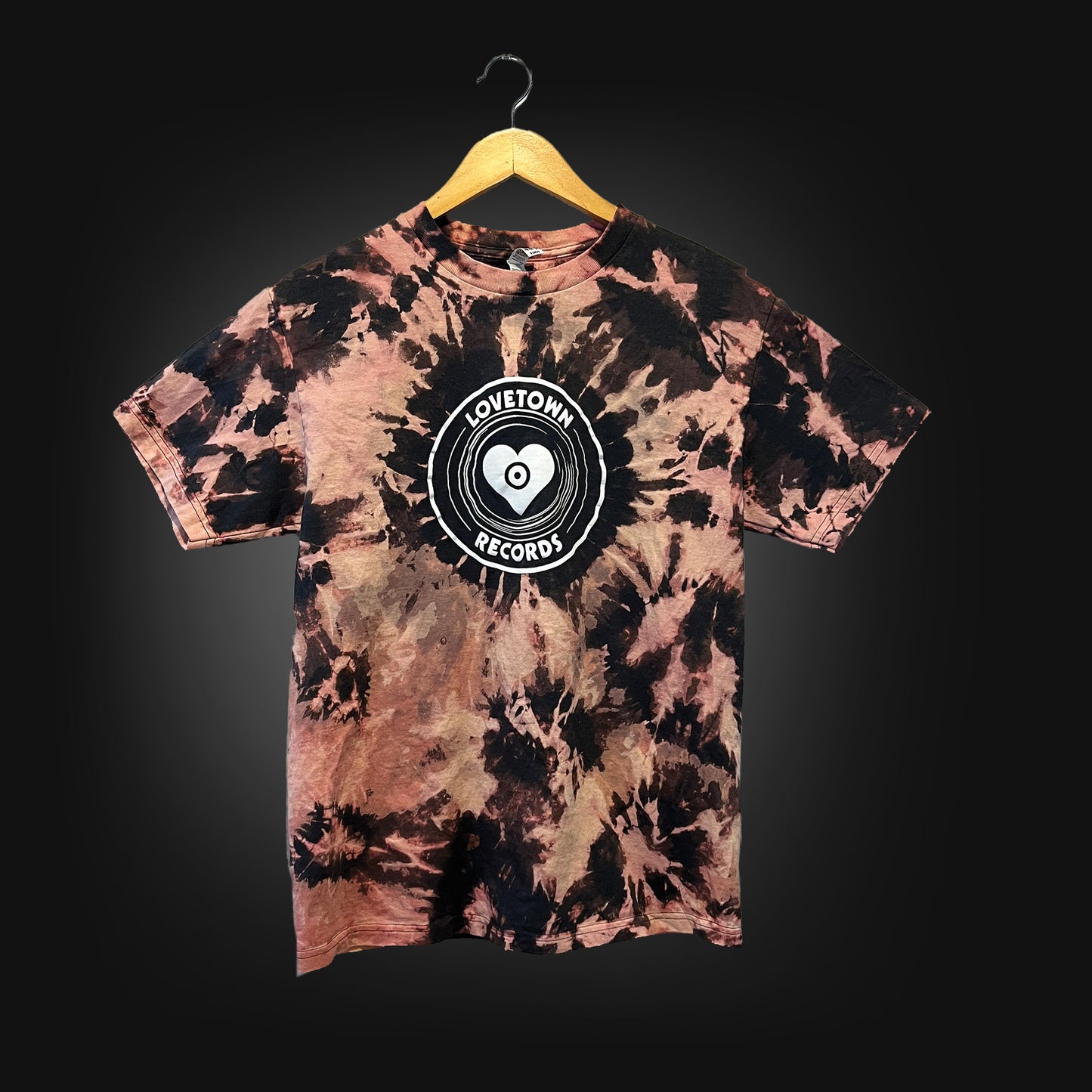 Grey t-shirt with a white logo that says "lovetown records", tied dyed with bleach.