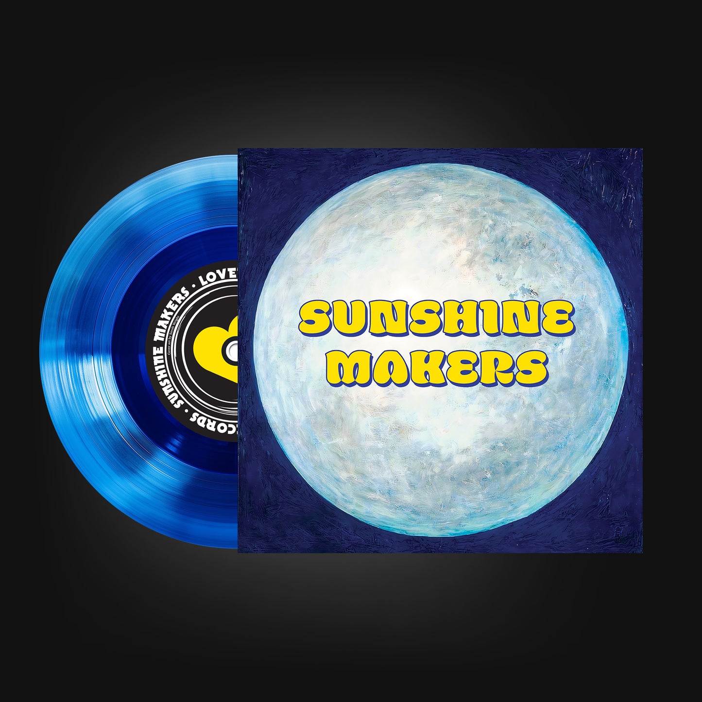 Showing one side of a seven inch vinyl record that is translucent blue. The cover has a painting of the moon with the name sunshine makers over it. The record has a yellow heart on the centre label with the name SUNSHINE MAKERS.