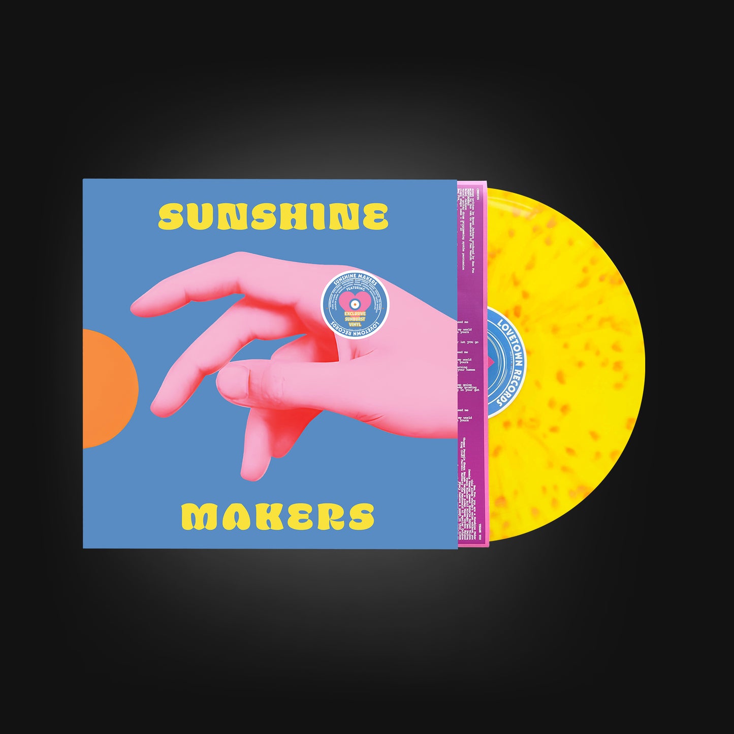 A bright yellow vinyl record with orange spots in it, sliding out of the cover jacket and printed inner sleeve. The record label says "LOVETOWN RECORDS" on it. The jacket cover is a light blue with a large pink hand reaching across to the touch a half orange circle on the left side. The cover has the name "SUNSHINE MAKERS" printed on it.